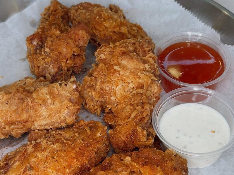 Golden fried chicken tenders with dipping sauces